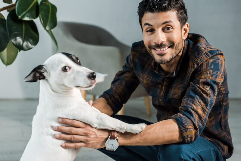 smiling man and dog | Ultimate Pet Nutrition