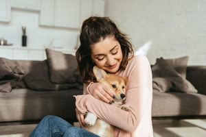 hugging puppy positive reinforcement | Ultimate Pet Nutrition